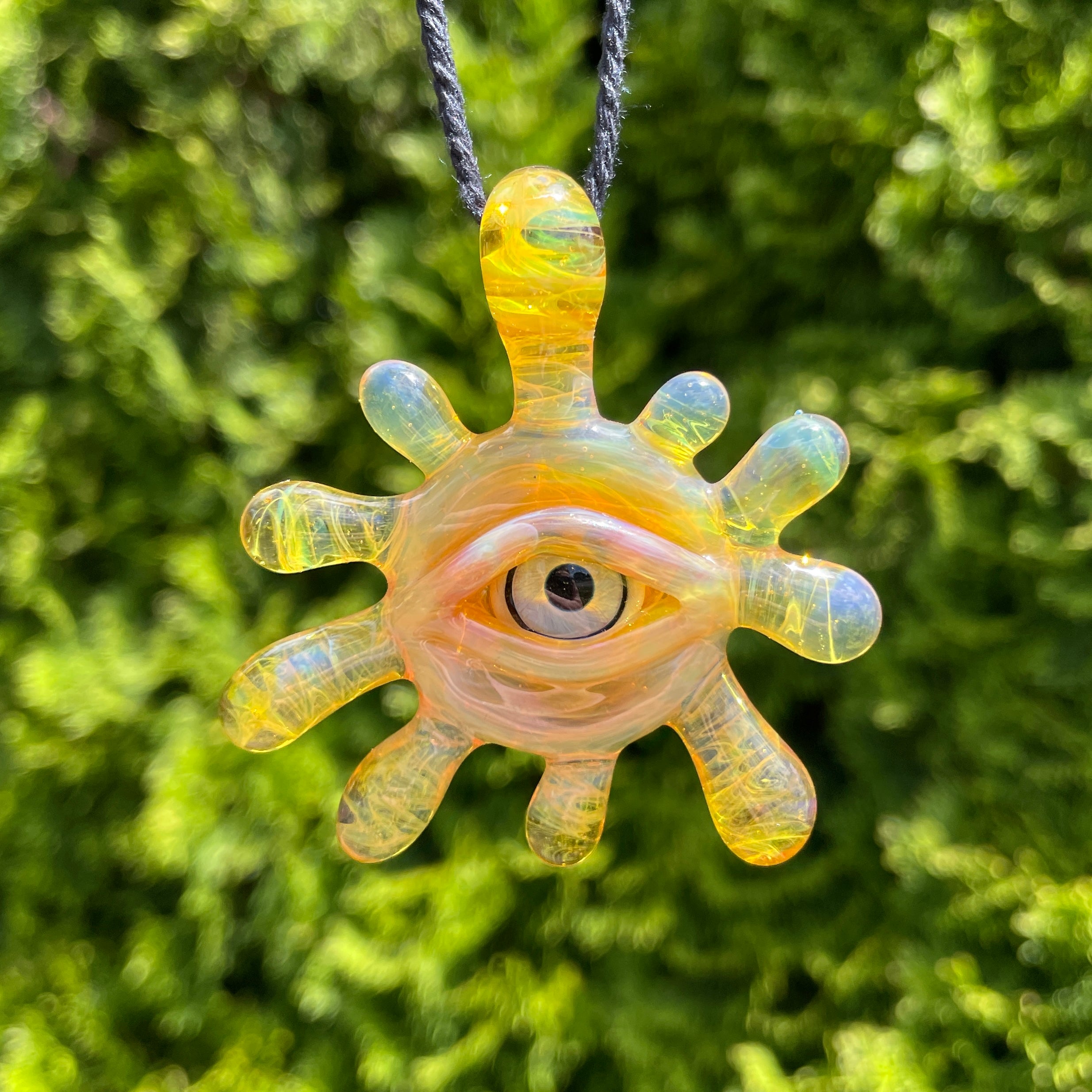 Heady sold glass eye pendant